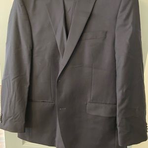 Men Michael Kors navy blue suit size 44R slightly warn one time.Purchase As Is